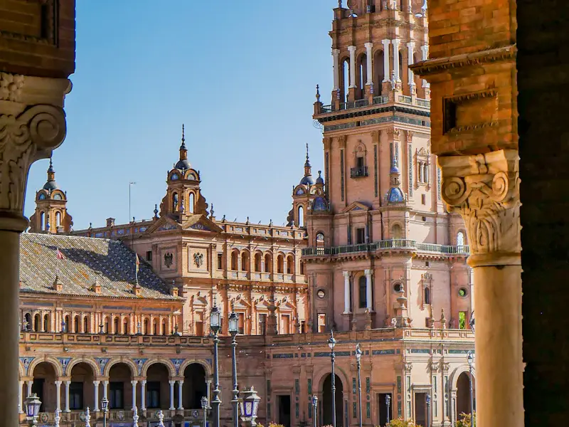 One of the towers of the Plaza de España against a blue sky