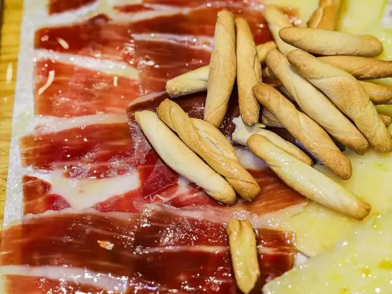 Slices of jamón with picos, the crisp little breadsticks